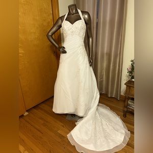 White corset back sweetheart neckline wedding gown.